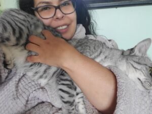 a woman holding a cat